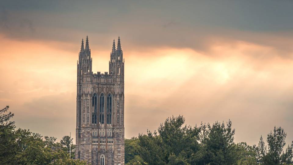 Graduate college in twilight and shafts of light