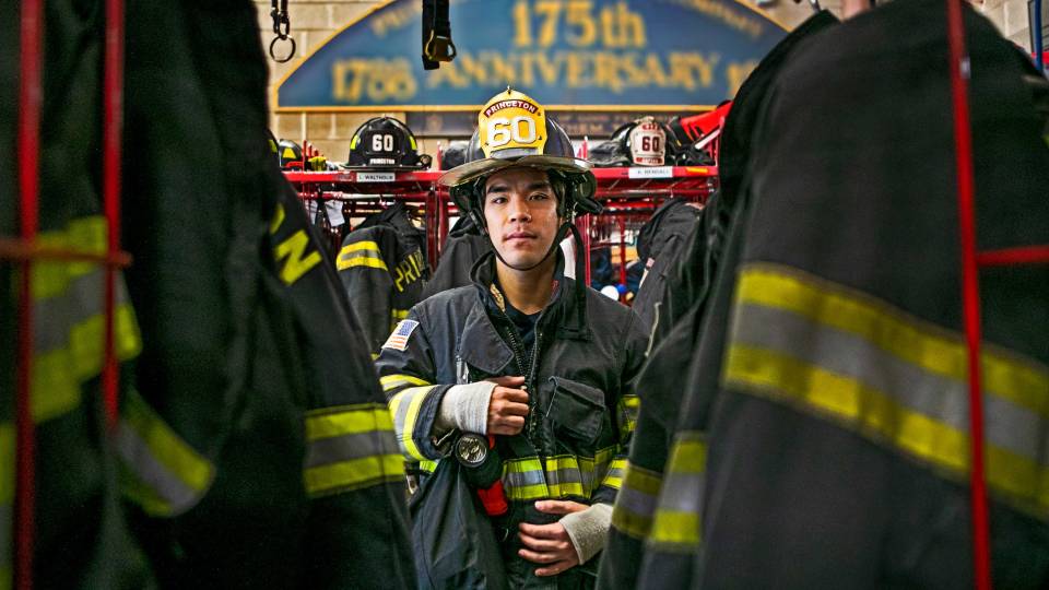 Max Nguyen amid the equipment at the firehouse