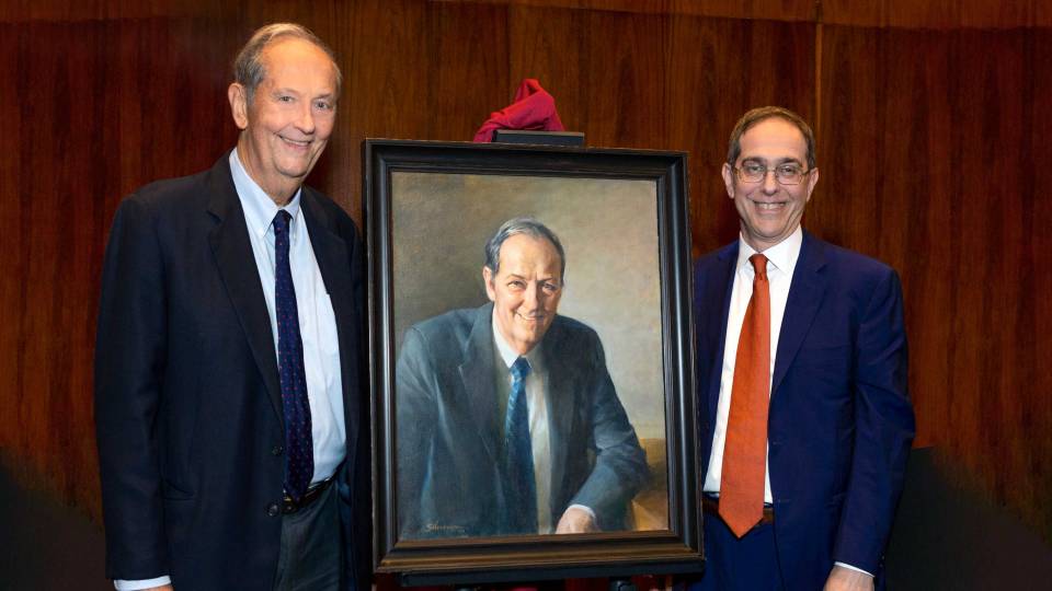 Bill Bradley and Christopher Eisgruber stand next to painting