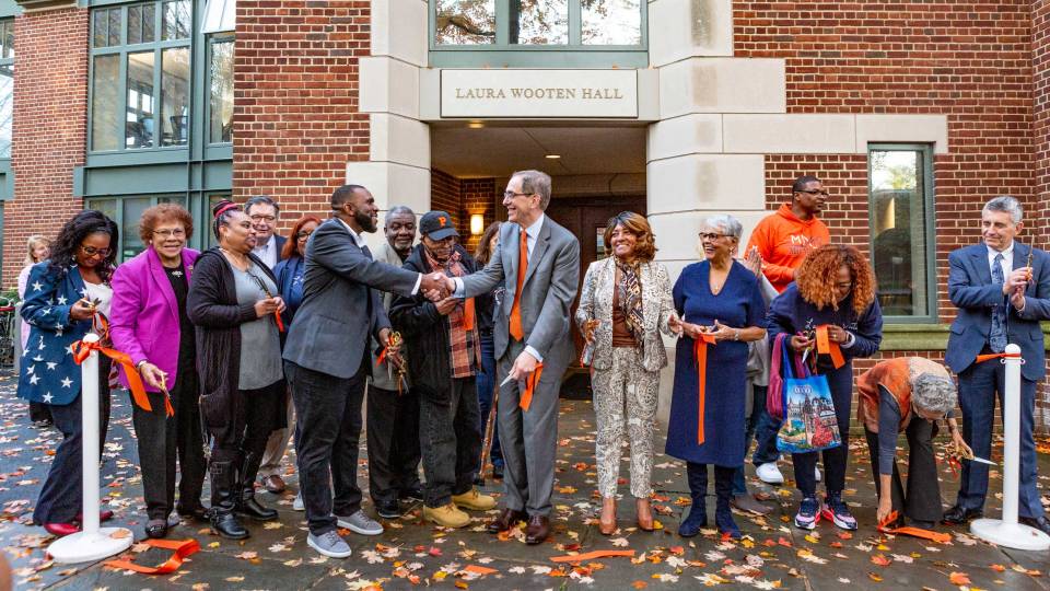 Eisgruber and Wooten family cut the ribbon to the newly dedicated building