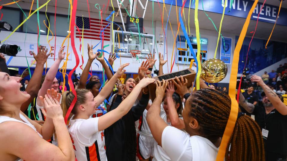 The women's team celebrates its Ivy Madness championship in New York at Columbia's Levien Gymnasium