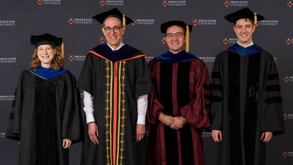 Three distinguished teachers pose with Princeton University President Christopher L. Eisgruber '83