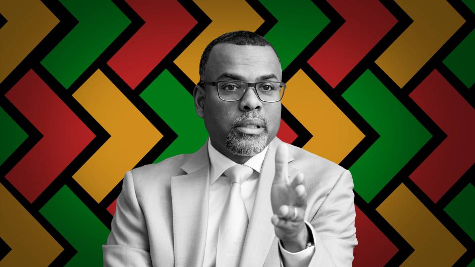 Eddie Glaude in front of a pattern of chevrons