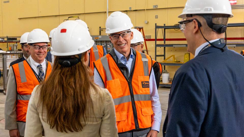 U.S. Secretary of Energy Wright wearing a hard hat on a tour at PPPL.