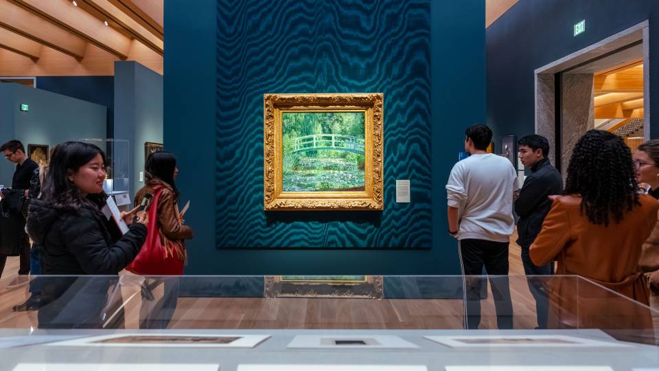Princeton students view Claude Monet's painting "Water Lilies and Japanese Bridge."