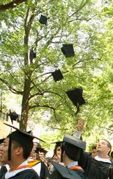 Graduates toss their hats