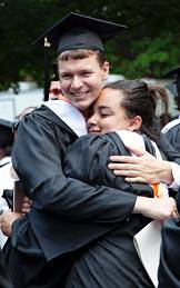 hugging graduates