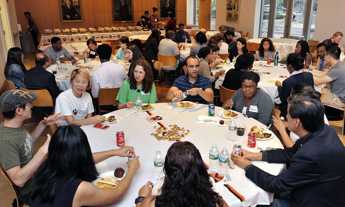 Faculty, staff and students from a variety of academic fields enjoy laughter, conversation and good food as they kick off the new academic year.