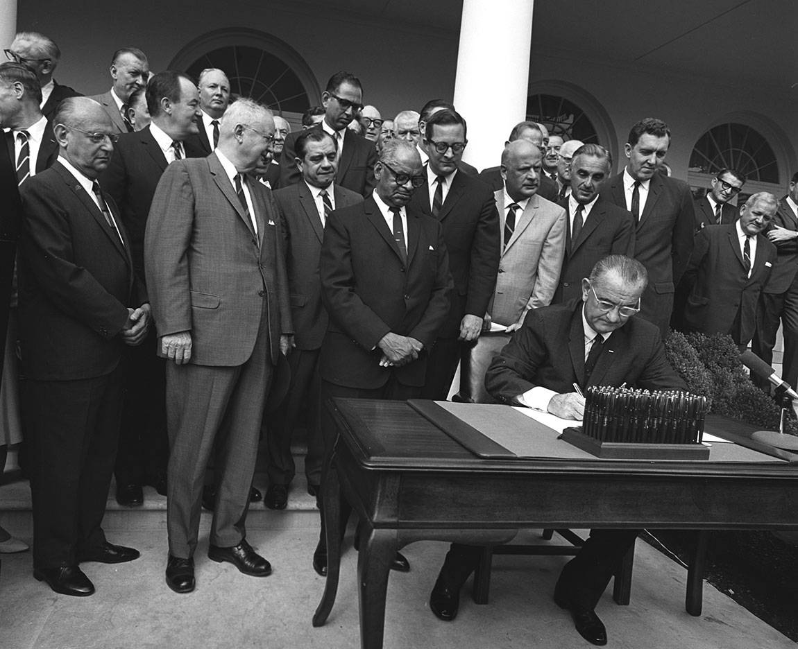 Discovery Race for Profits President Johnson signing HUD bill