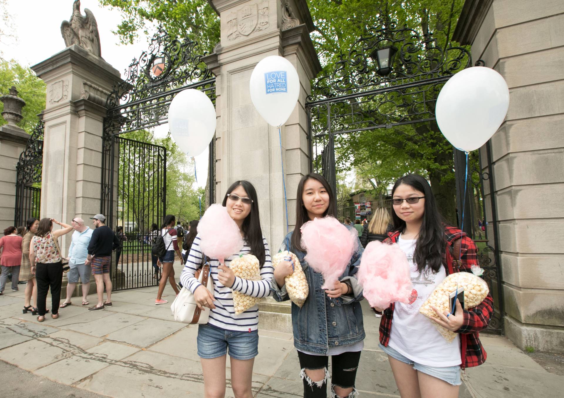 Three girls at the Fitzrandolph Gates at Communiversity 2017