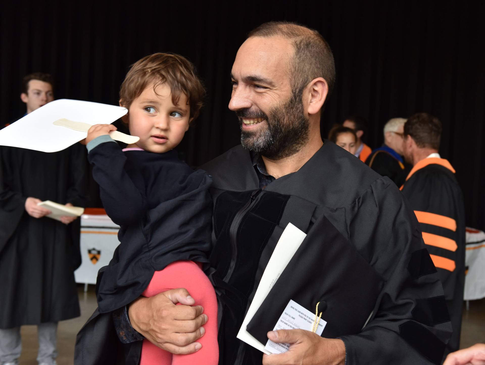 Student stands with child