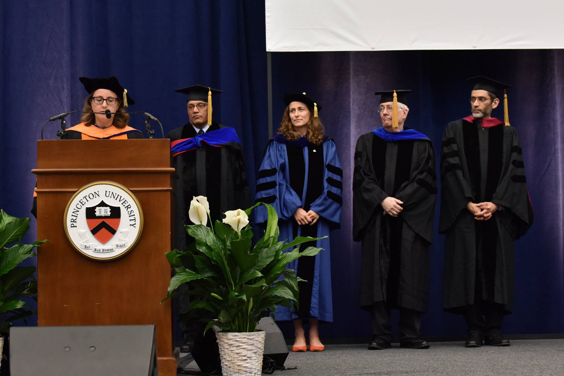 Graduate Mentoring Award recipients stand on stage