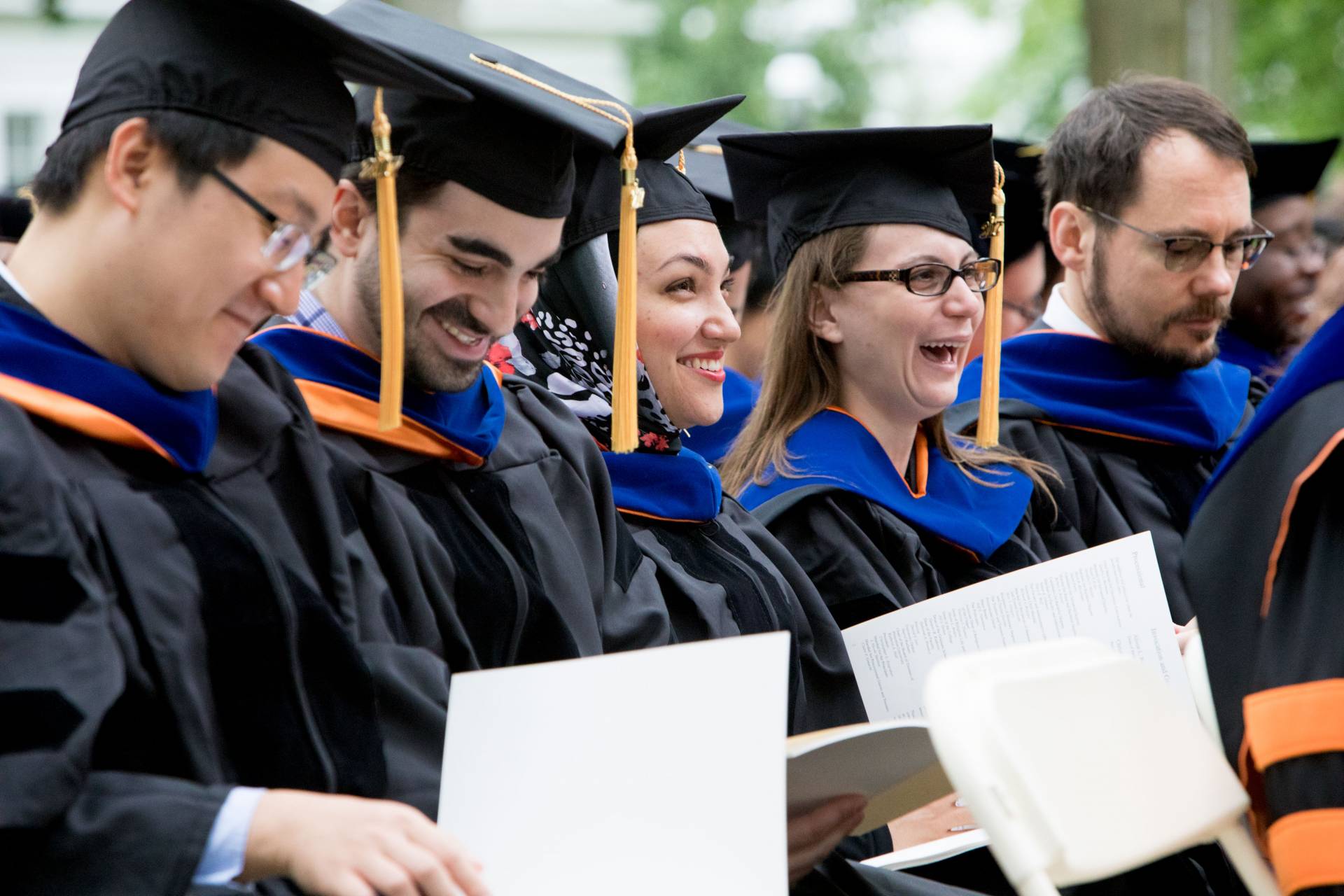 Graduate students laughing at Salutatory address