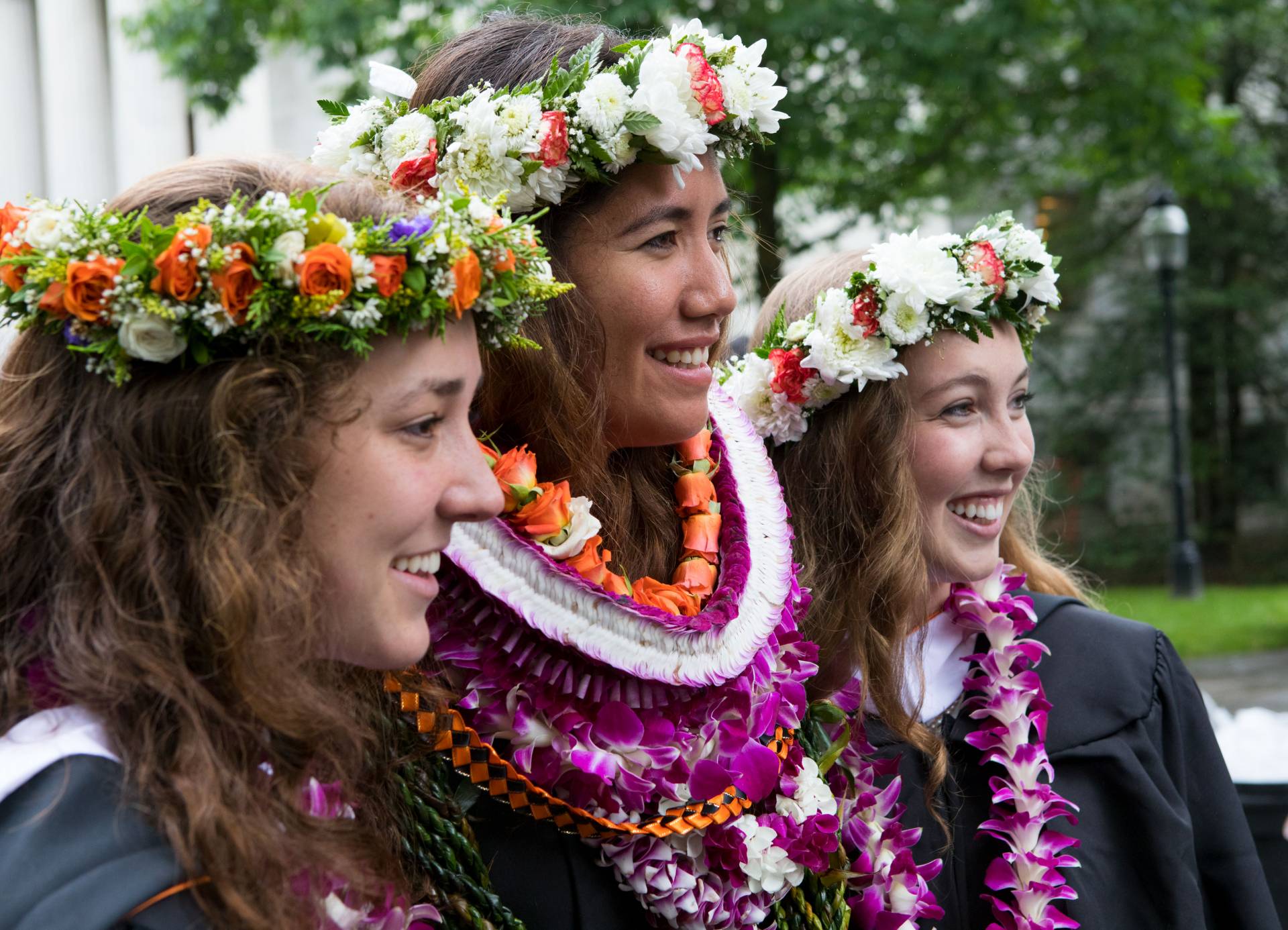 Students decked with leis after Commencement 2017 ceremony