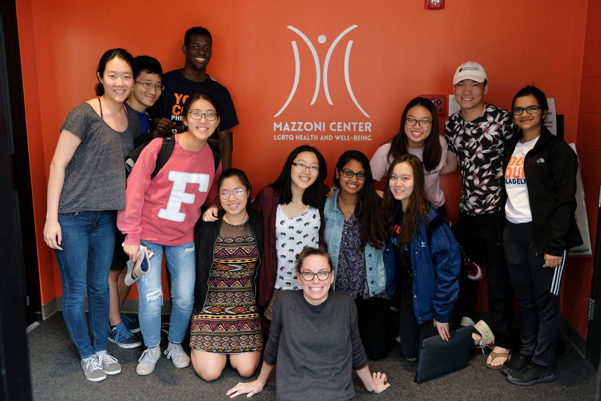 Students posing in front of Mazzoni Center sign