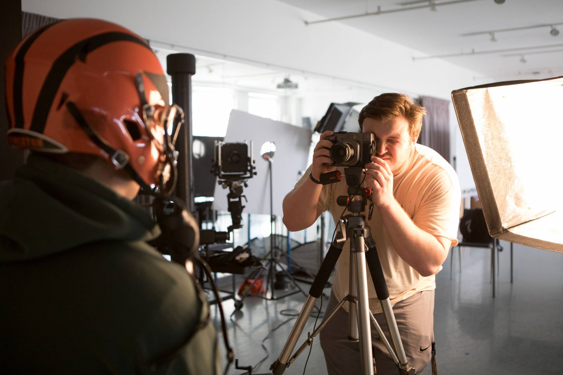Logan photographs student in studio