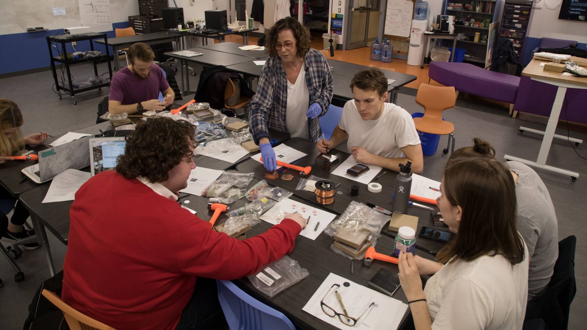 Students making viking-inspired jewelry