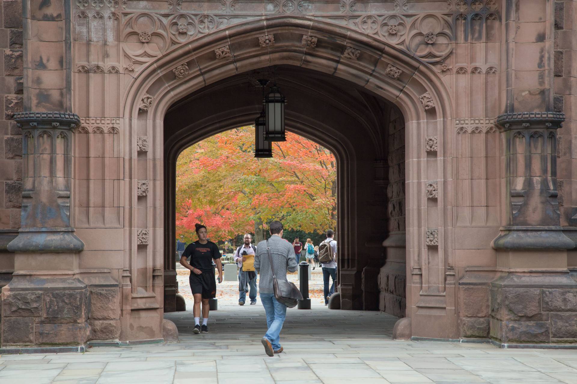 Students walking through East Pyne arch