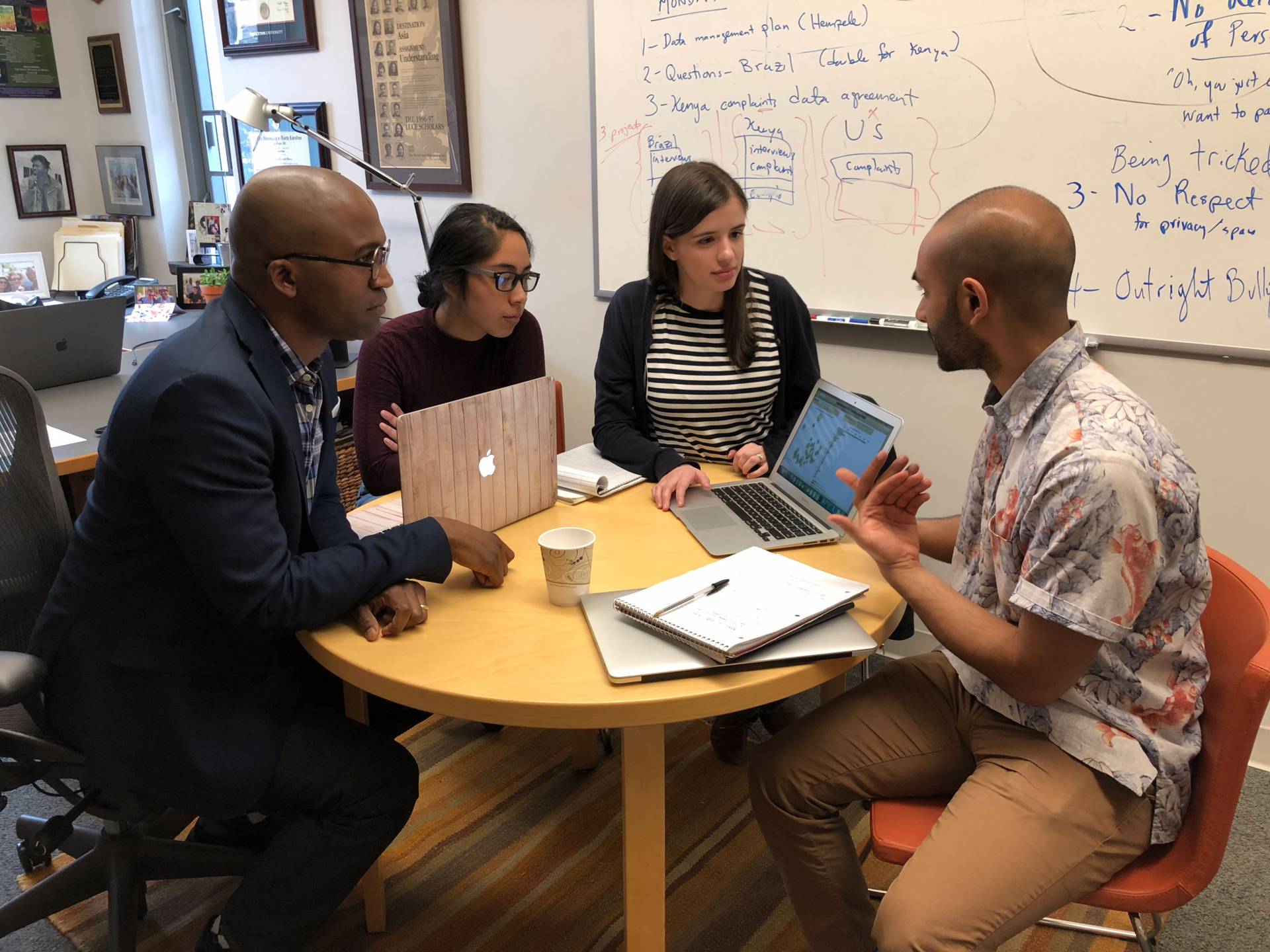 Frederick Wherry talking with Parijat Chakrabarti. isabel Jijon and Gabriela Oseguera Serra