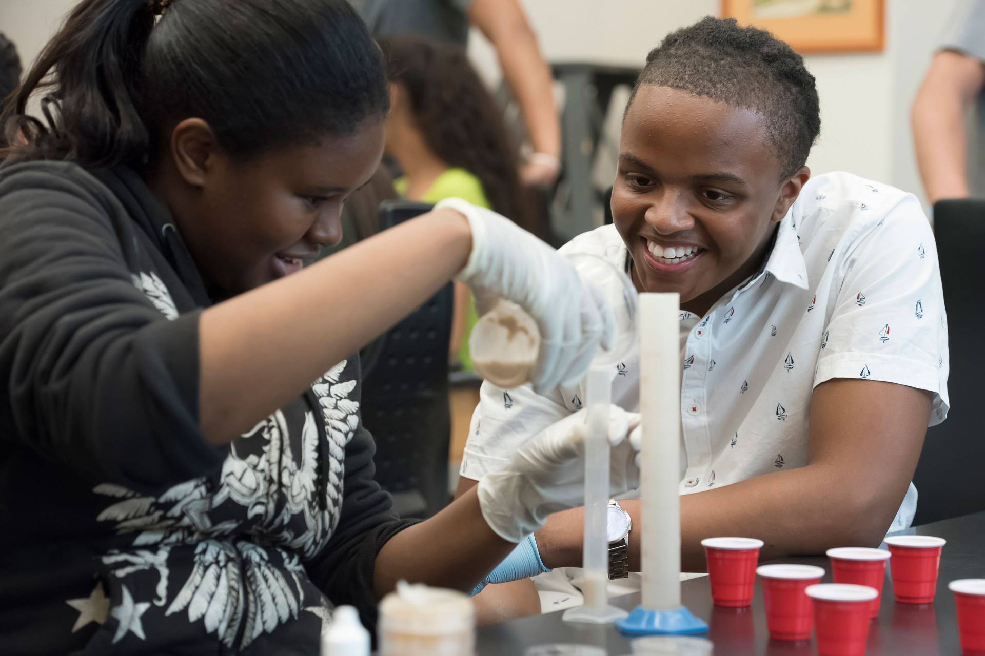 Mia Williams and Yamir Chapman work on experiment in lab