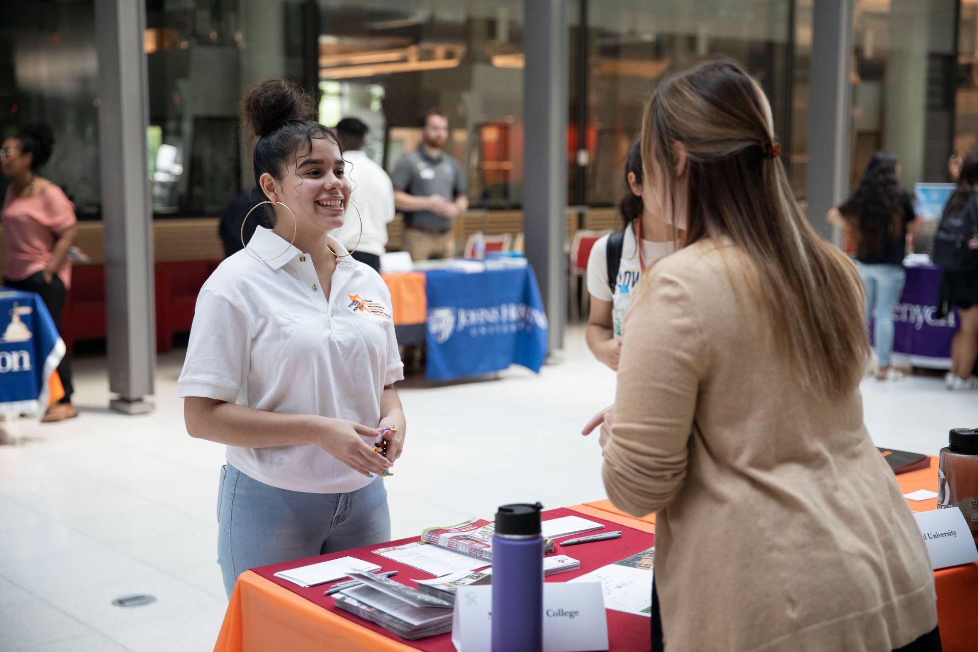 Taina Arguedas speaking with admission counselor