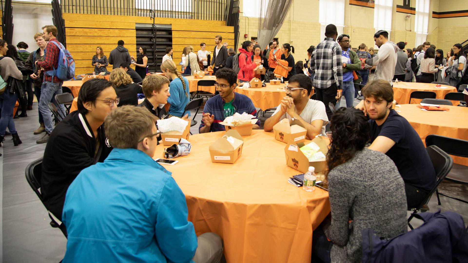 Graduate students eating lunch during orientation event
