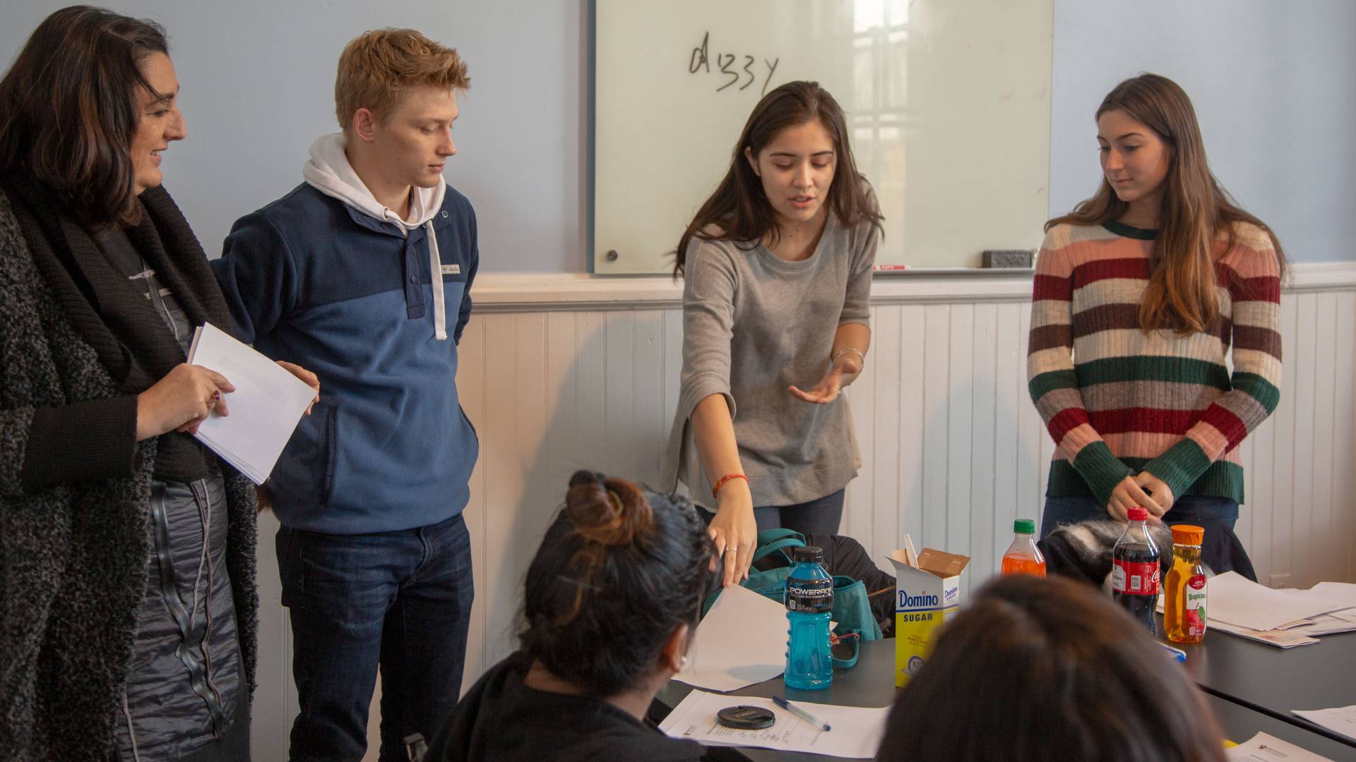 Students giving presentation to guests
