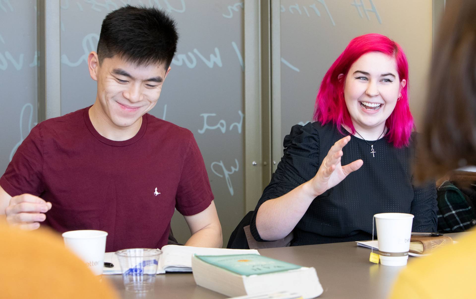 Student speaking in class while other student listens