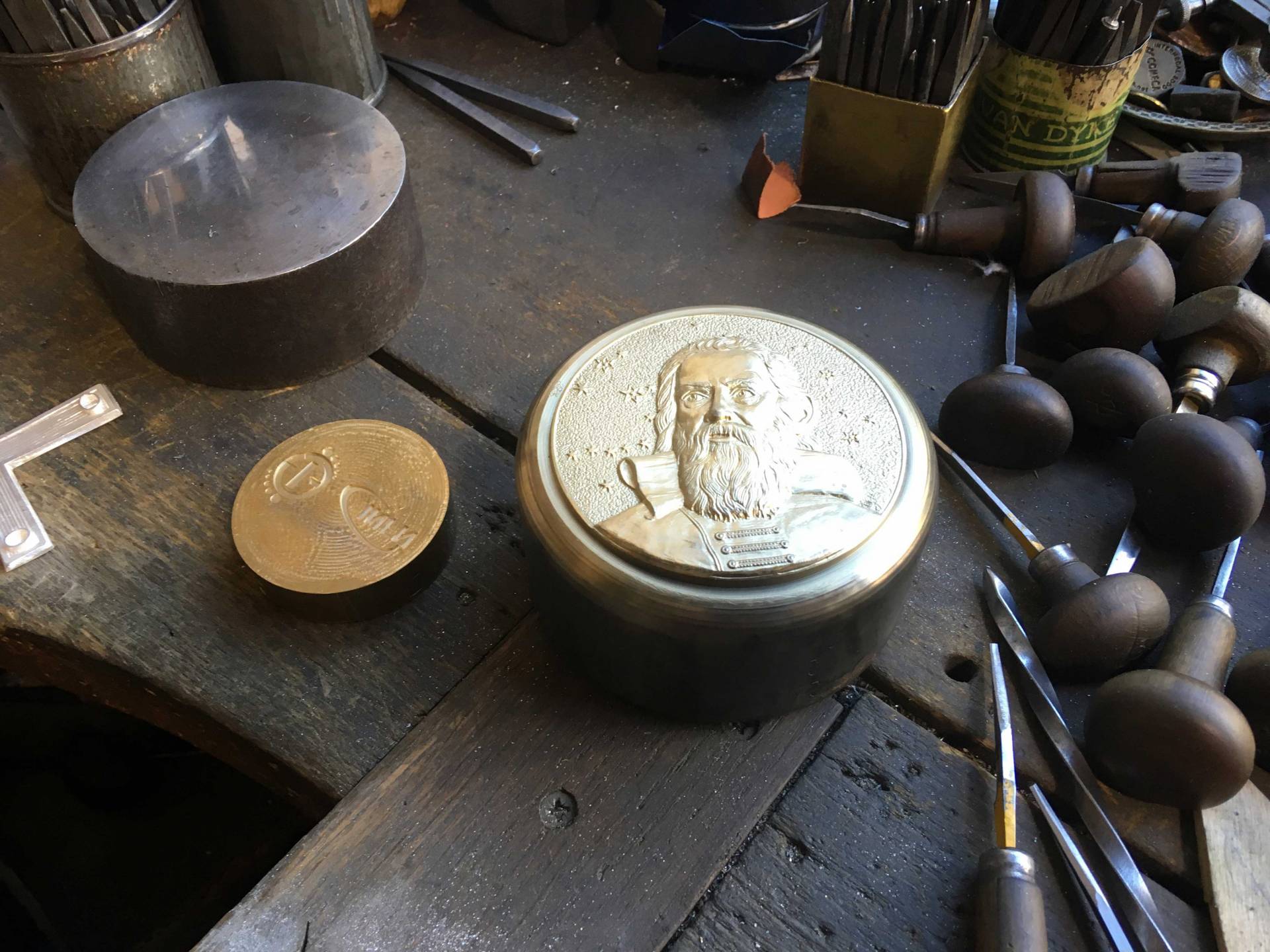 Galileo Medal surrounded by artisan tools