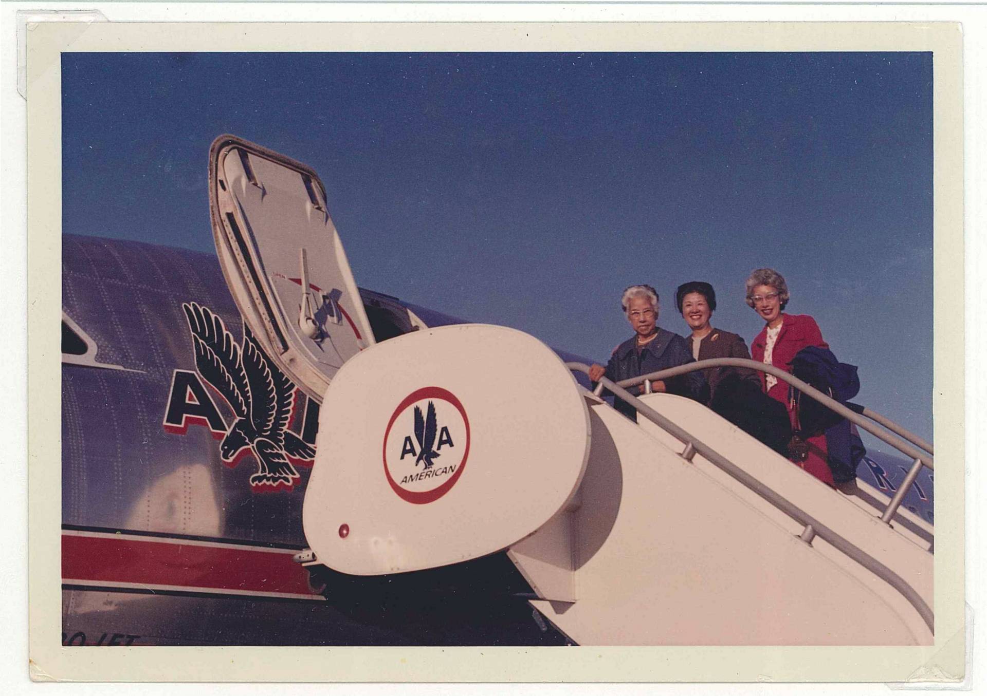 3 women boarding an airplane