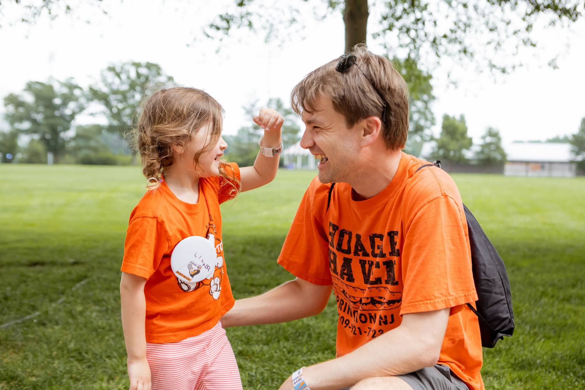 Erik Williamson and his daughter, wearing orange T-shirts