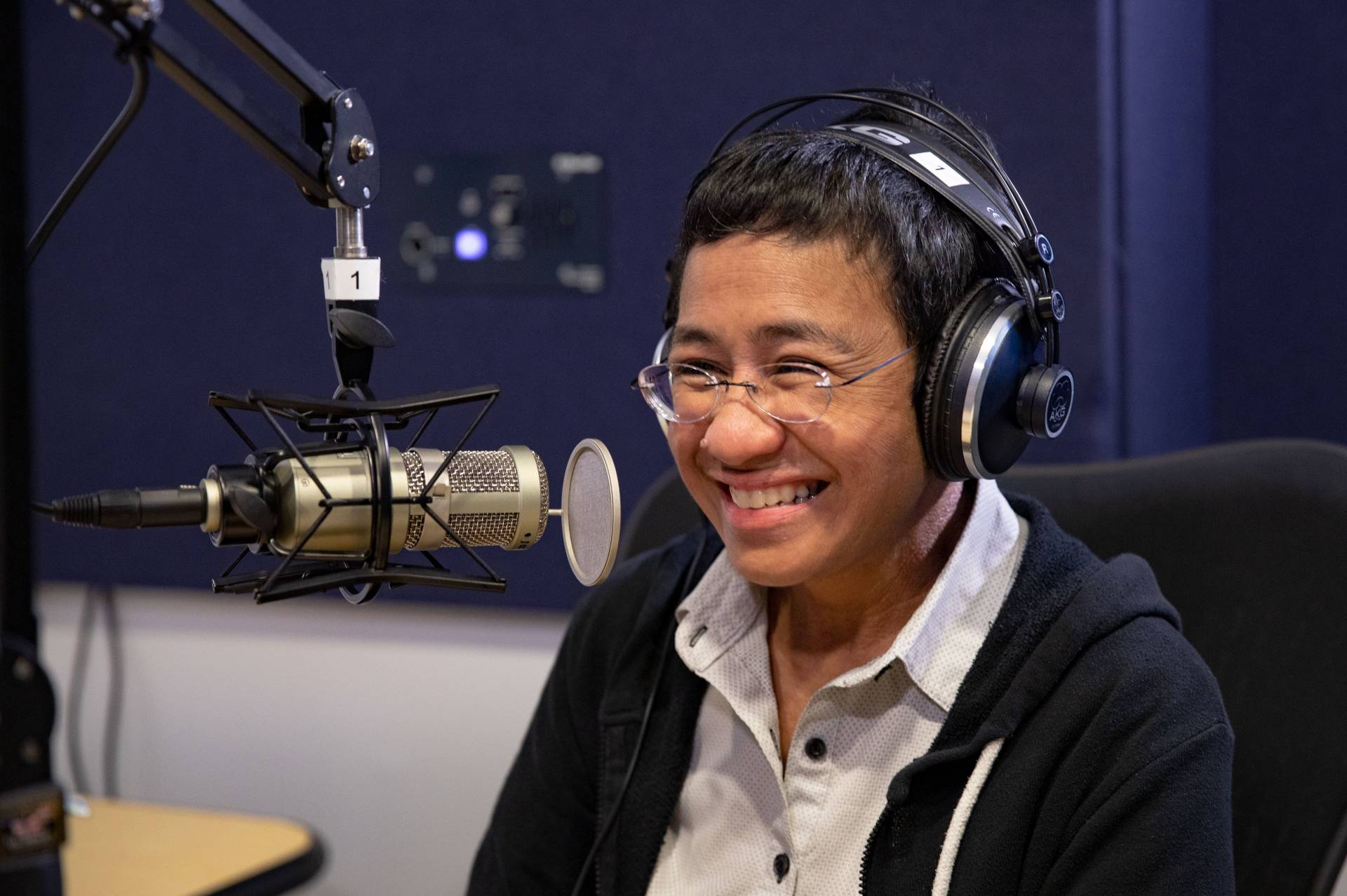 Maria Ressa in a recording booth