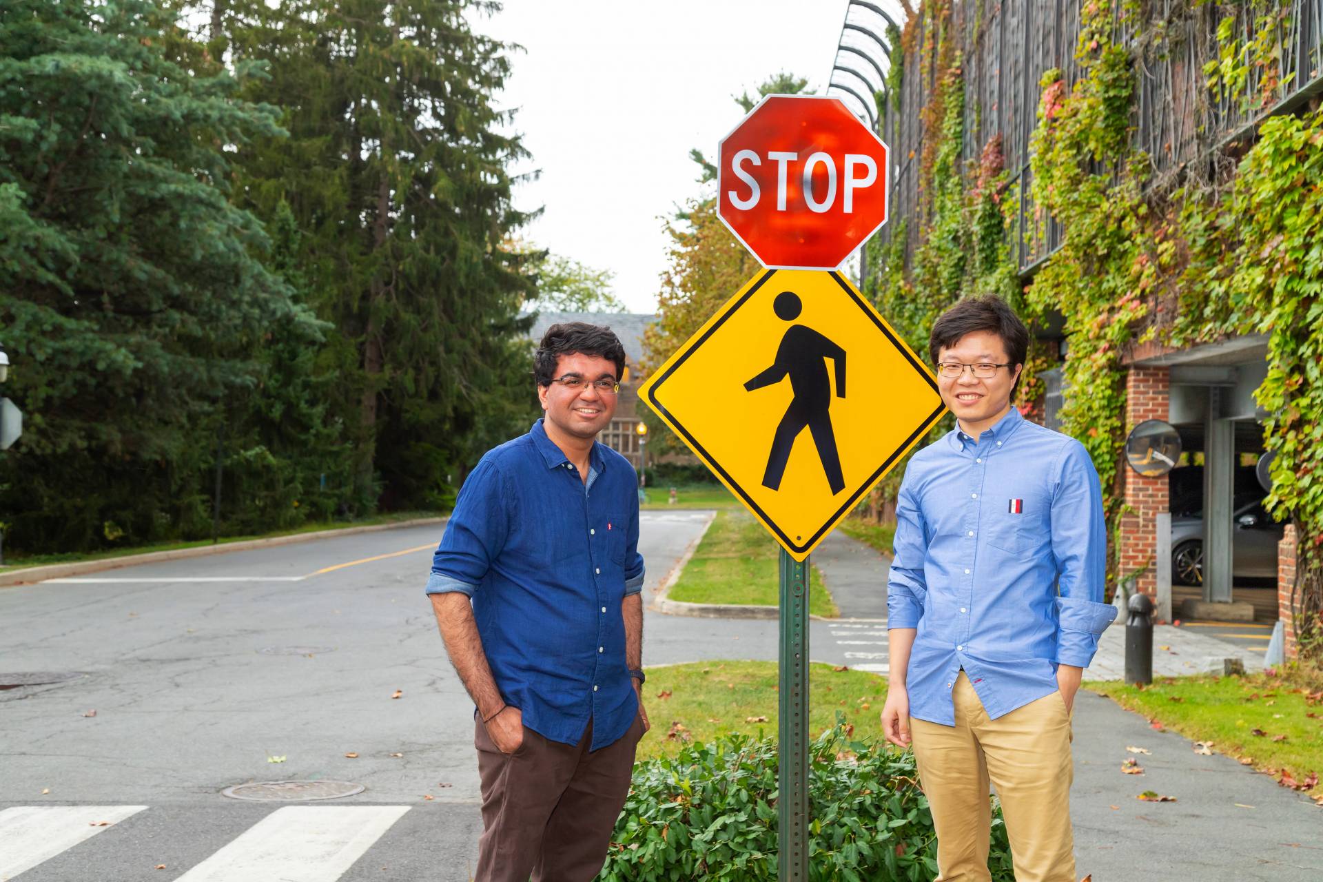 Researchers next to a stop sign