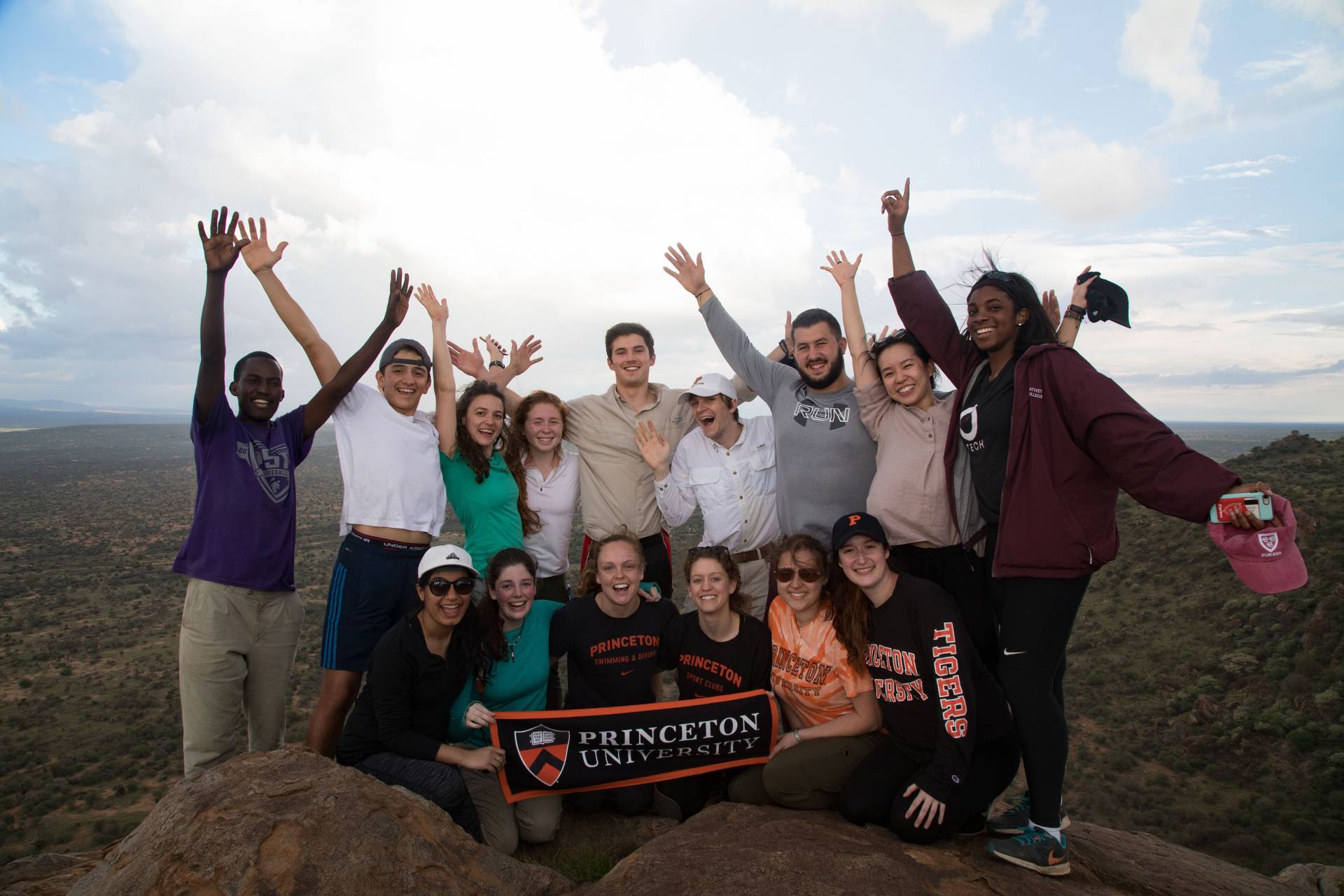Students reach a summit after a hike