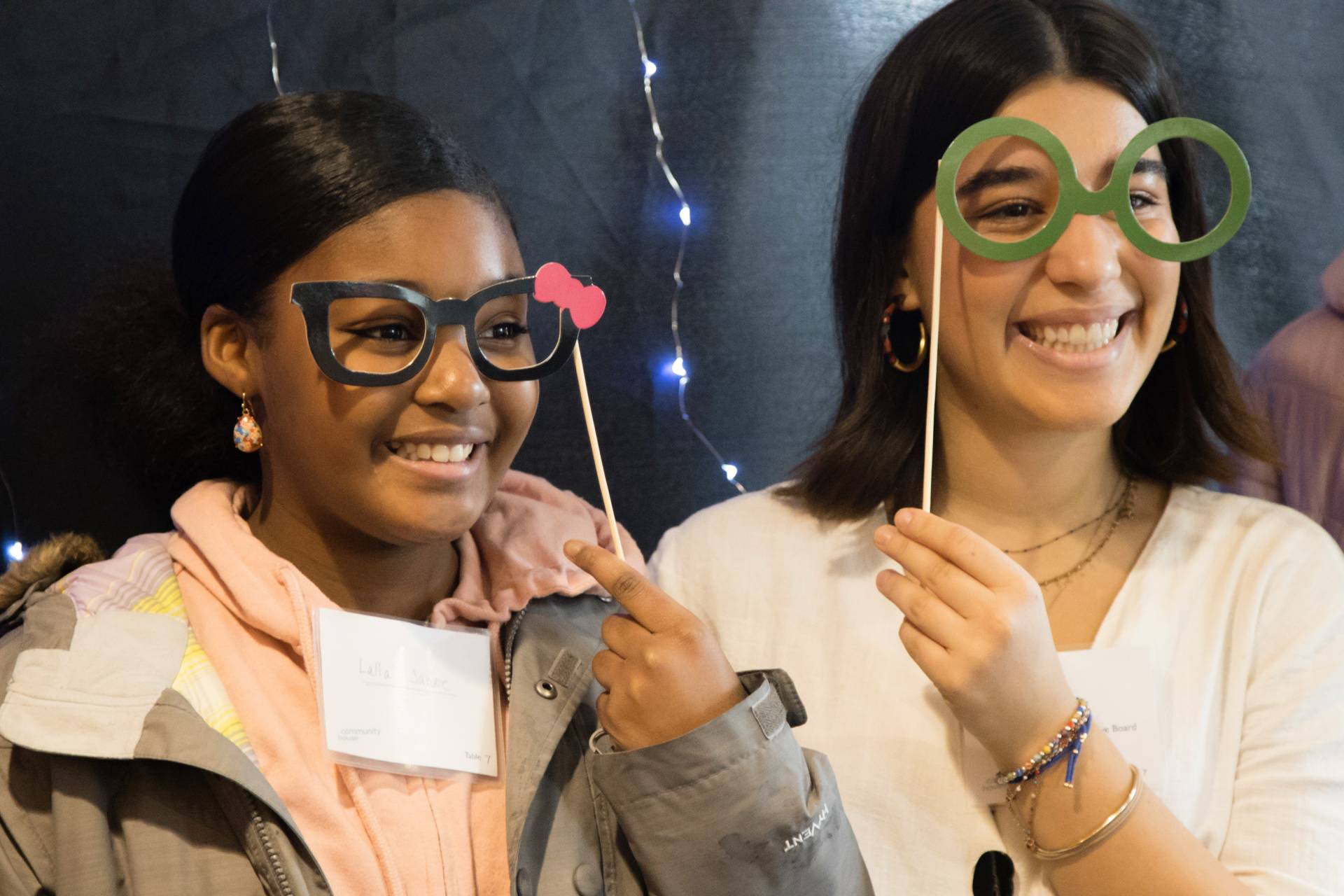 2 young women pose with mask glasses