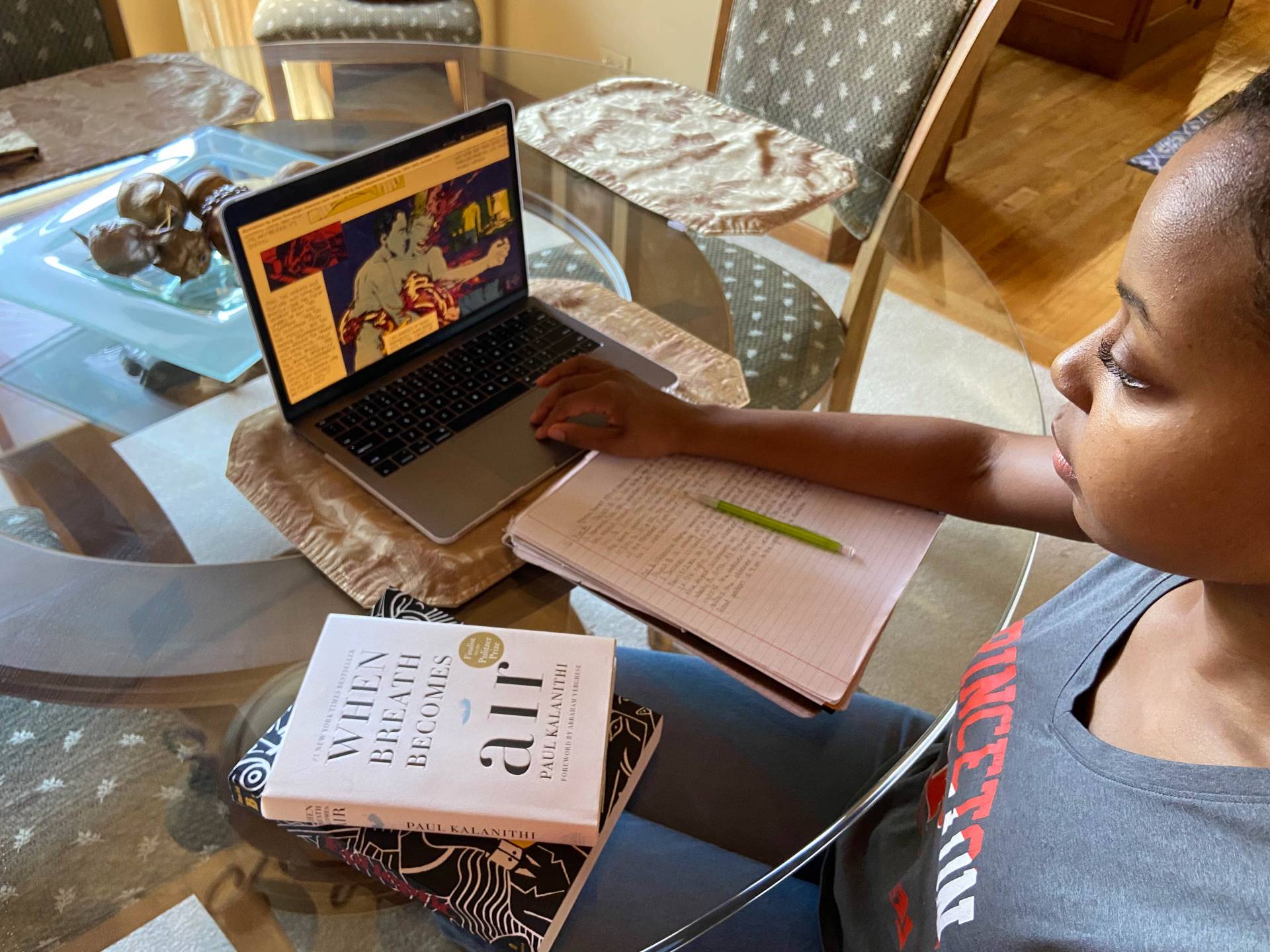 A student studies in front of a laptop