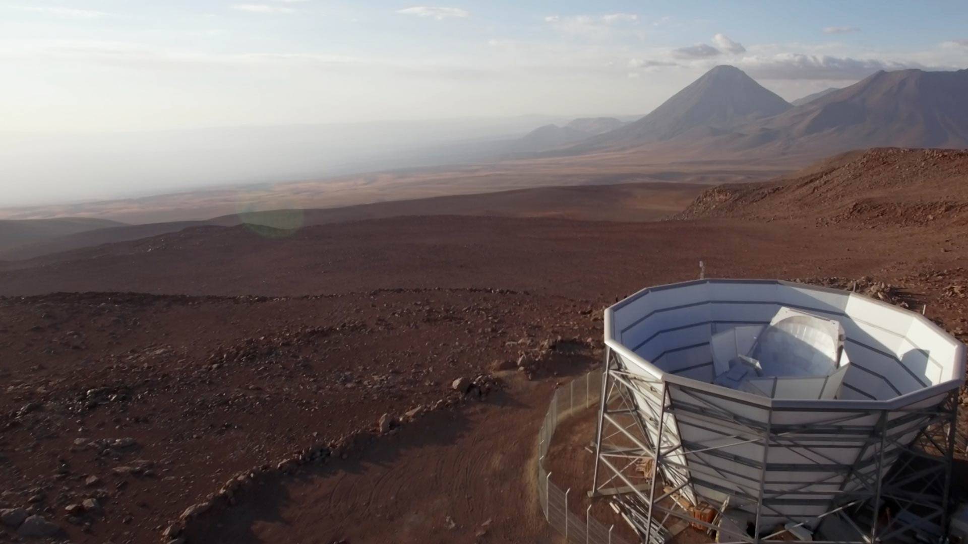 Atacama Desert landscape with telescope in the foreground
