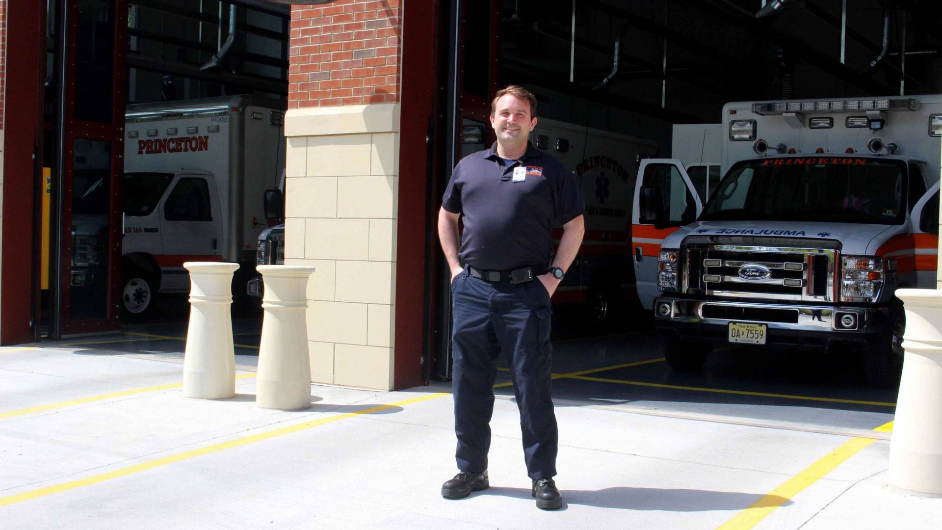 Eric Mills  stands in front of the Princeton First Aid & Rescue Squad buliding