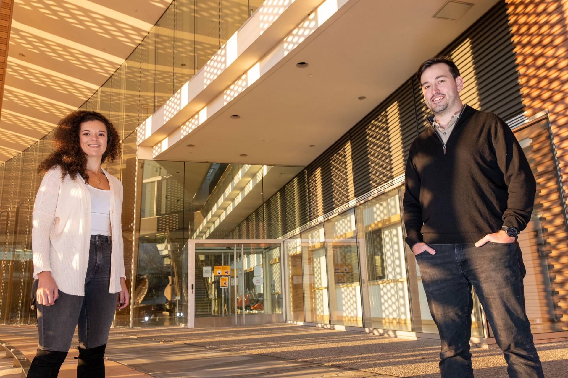 Alexis Cowan and Michael Neinast at the entrance of the Icahn building