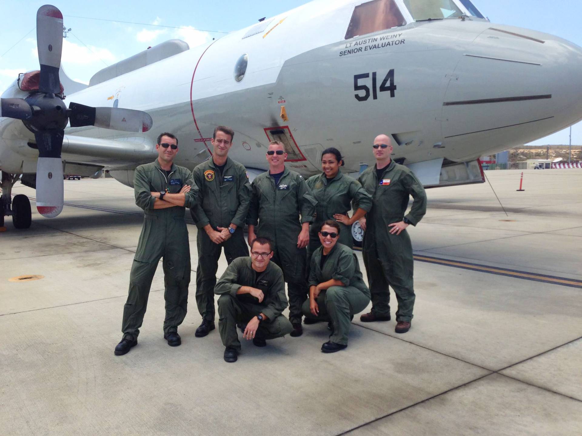 Clariza Macaspac and colleagues in front of a military jet