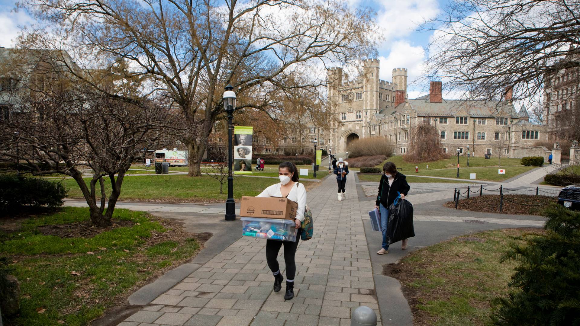 A student moves boxes of belongings onto campus