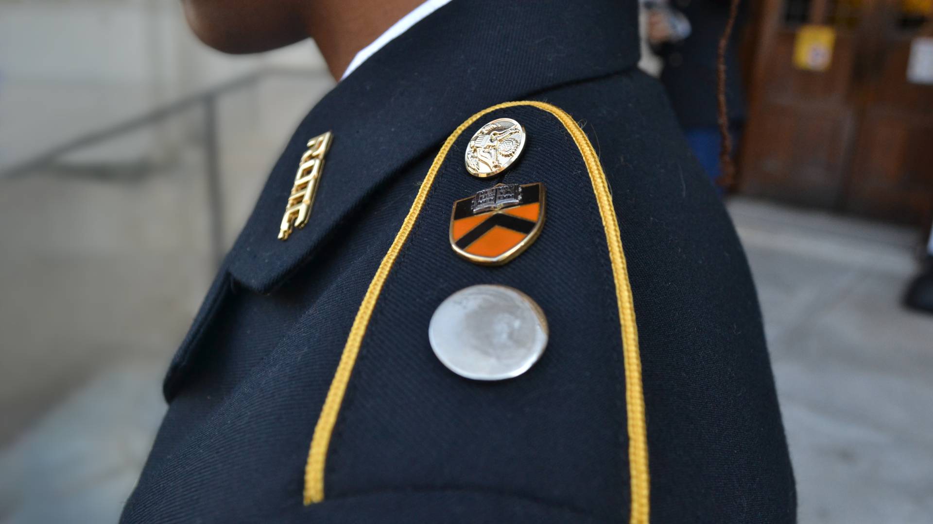 The insignia on the shoulders of a student