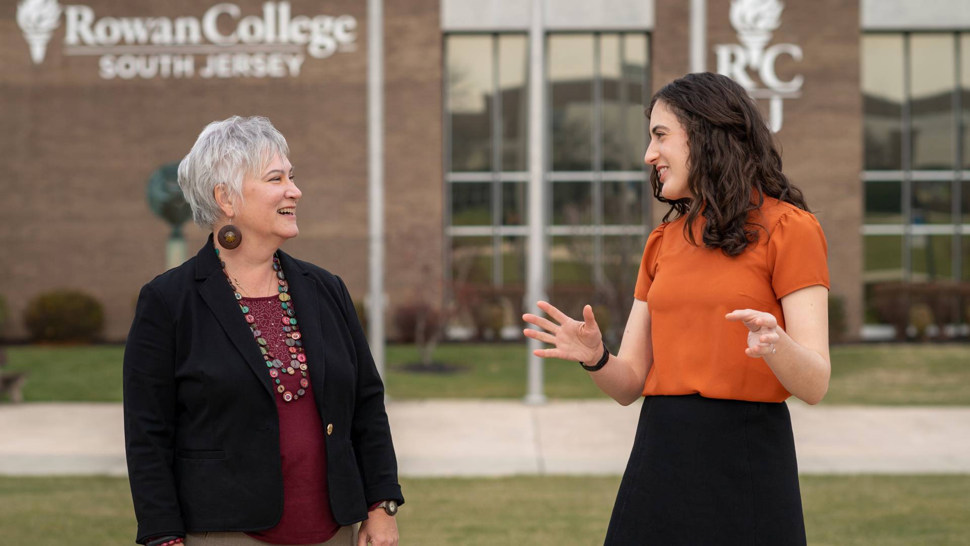 two women speaking to each other on Rowen College campus