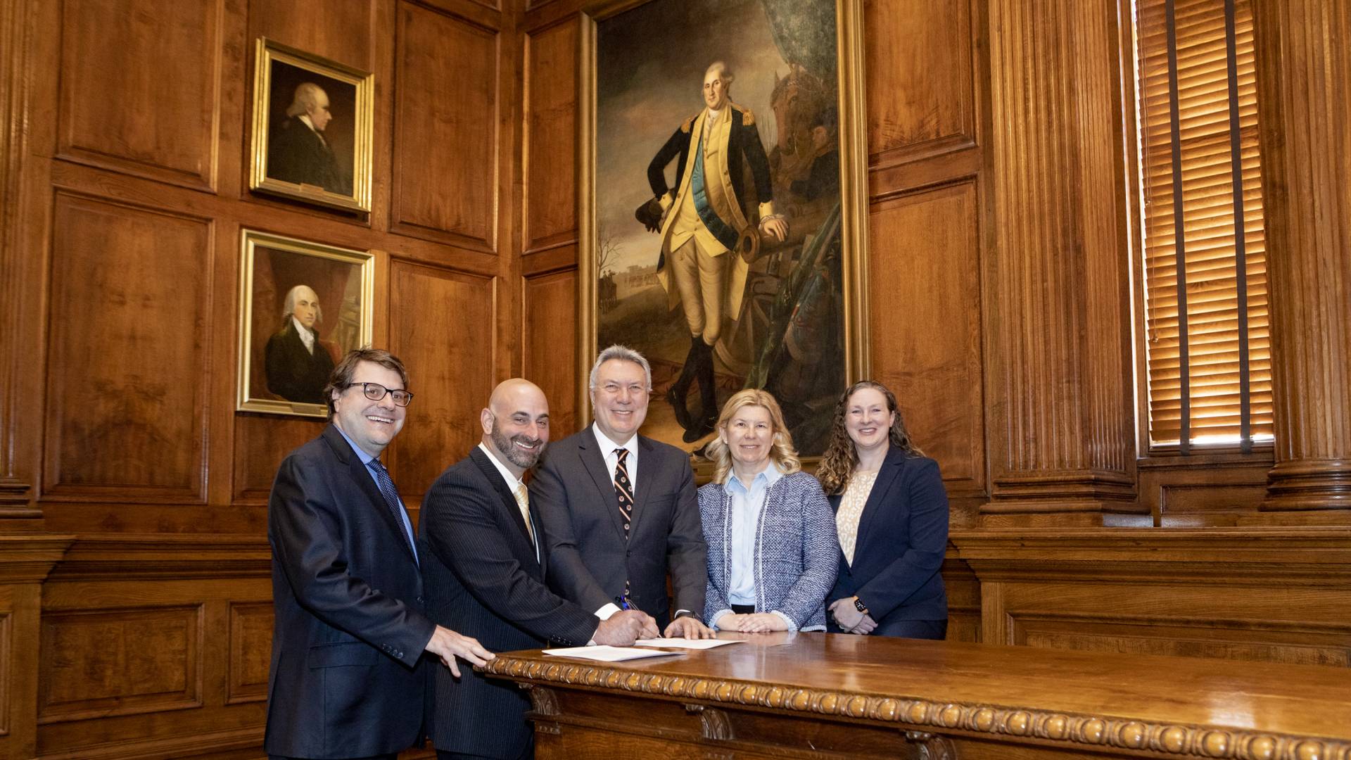 Five officials sign the DOE/PPPL contract in Nassau Hall's faculty room