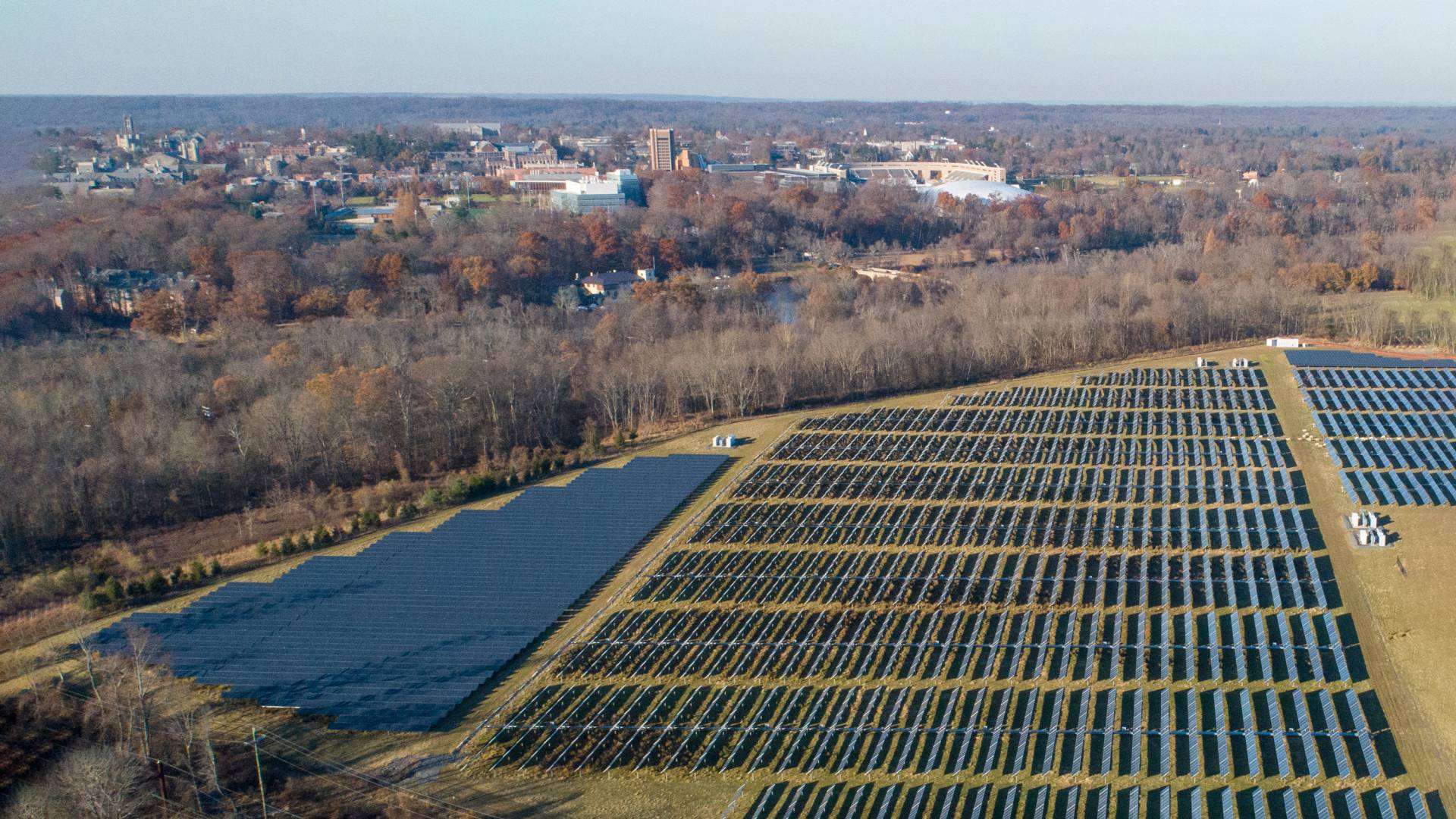arial of a large field full of solar panels