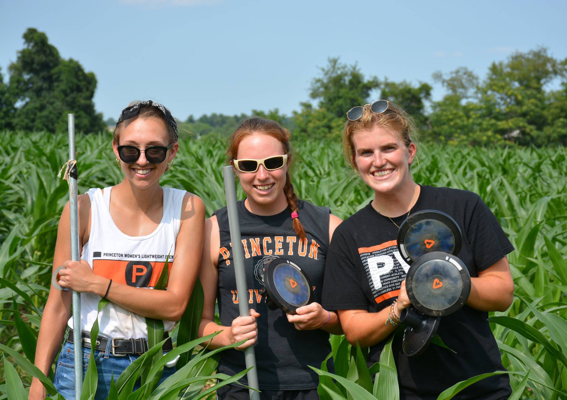 Three agricultural interns in the field
