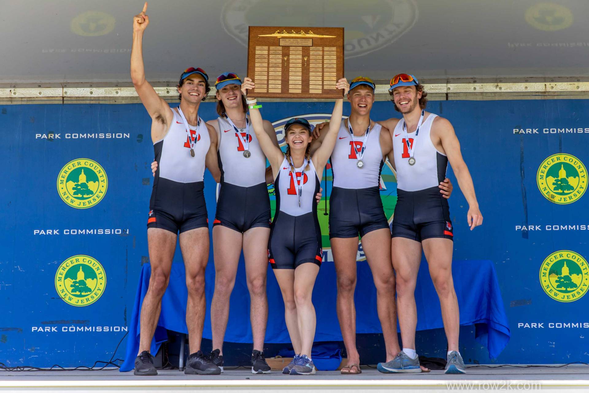 5 person rowing team at the podium