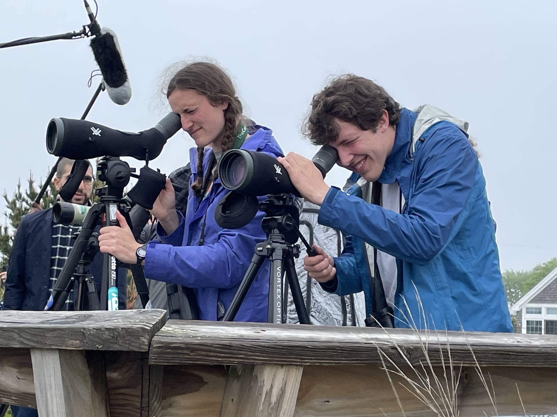 Two students use scopes to find various species of birds