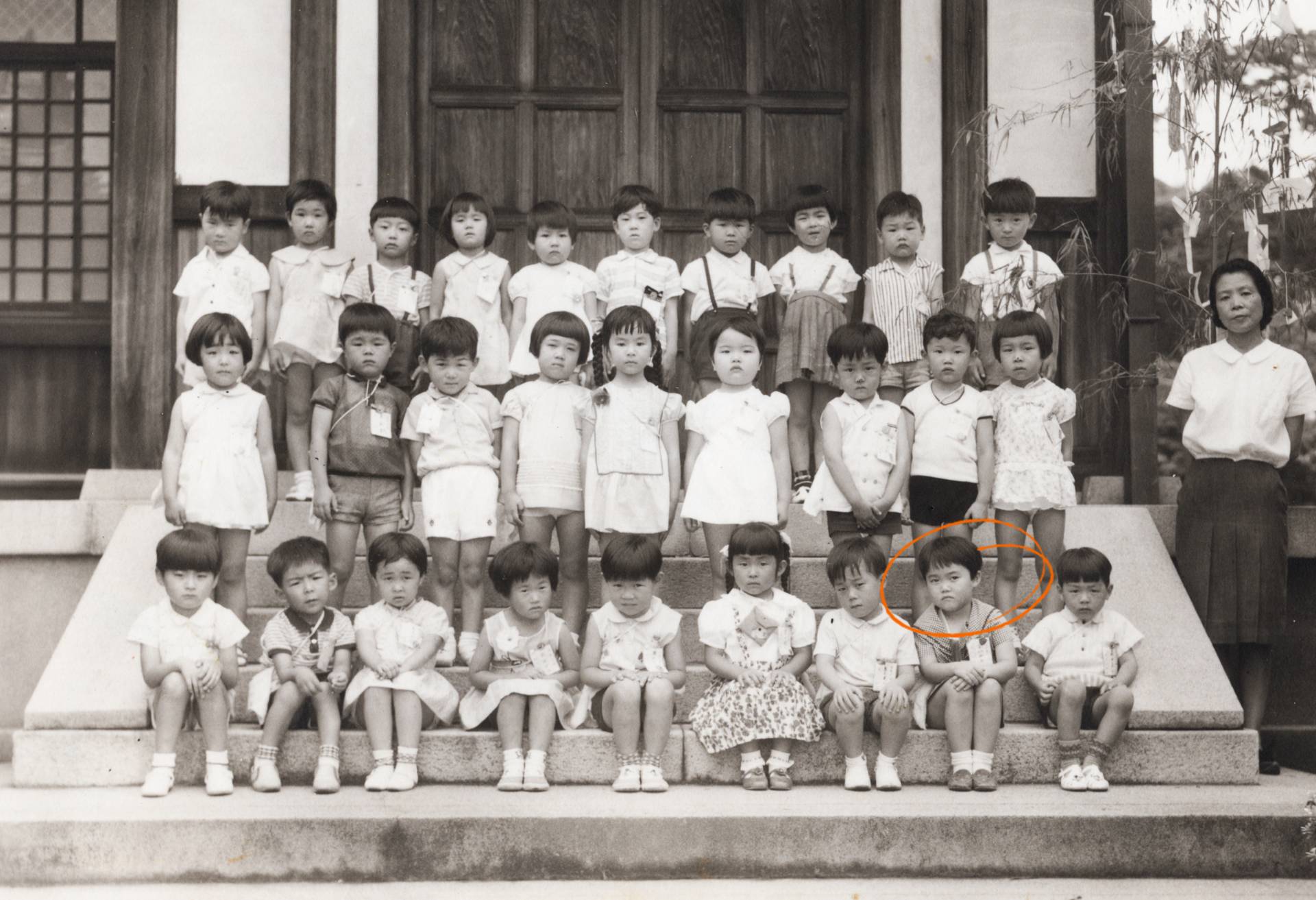 Akiyama (bottom row, second from right) with her kindergarten class in the city of Nara, Japan.