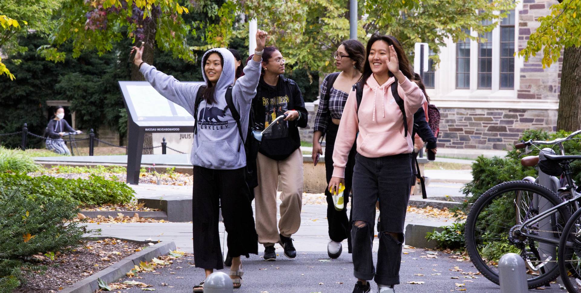 Four female students walking on Scudder Plaza